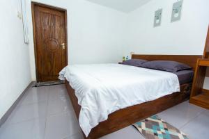 Postel nebo postele na pokoji v ubytování Tastura Homestay