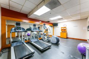 a gym with treadmills and ellipticals in a room at Metro Scottsdale Promo 1 bd 1 in Scottsdale