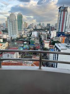 a view of a city from a balcony at Birchtower studio in Manila