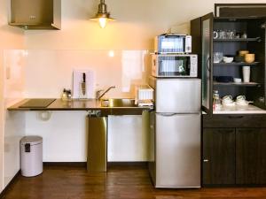 a small kitchen with a sink and a refrigerator at Niruyakanaya BISE - Vacation STAY 44389v in Bise