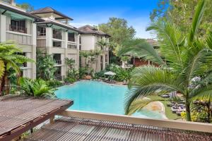 an image of a swimming pool at a resort at Private Apartments in the Temple Beachfront Resort Palm Cove in Palm Cove