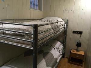 a bedroom with two bunk beds in a room at FeWo Eberau in Ebrach