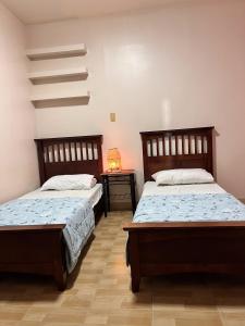 Cama o camas de una habitación en Family House in Cagayan de Oro City