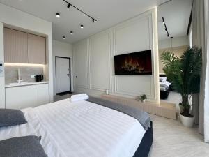 Postel nebo postele na pokoji v ubytování Апартаменты LUX (Smart 8)