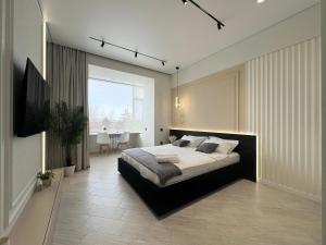 Postel nebo postele na pokoji v ubytování Апартаменты LUX (Smart 8)