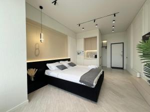 Postel nebo postele na pokoji v ubytování Апартаменты LUX (Smart 8) + 12 fotografií