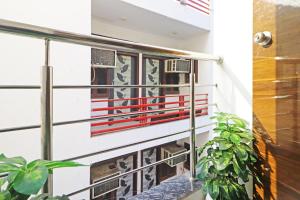 a balcony with an american flag on it at Hotel Vijaydeep Palace Near Delhi Airport in New Delhi