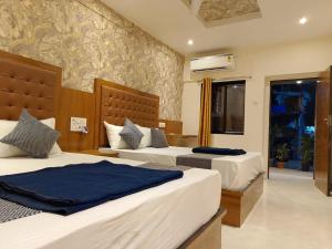 Postel nebo postele na pokoji v ubytování Hotel BKC Fortune