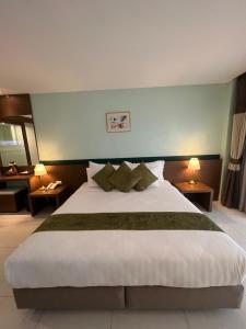 Ένα ή περισσότερα κρεβάτια σε δωμάτιο στο Siam Triangle Hotel Chiang Sean