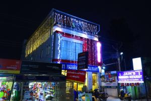 a lit up building with christmas lights on it at JP RESIDENCY in Yelagiri