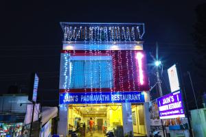 a building with christmas lights on top of it at JP RESIDENCY in Yelagiri