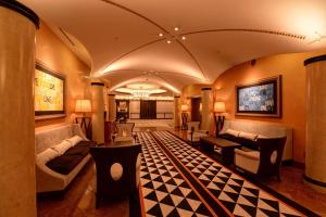 a living room with a couch and a table at Hofu Grand Hotel in Hofu