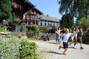 a group of children running in a yard at Wolfeicherhof in Eggstätt