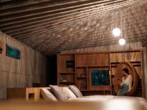 Denpaku The Beachfront MIJORA客房内的一张或多张床位