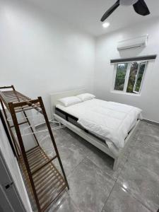 Säng eller sängar i ett rum på H&K Residency/Homestay