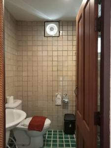 Koupelna v ubytování Sripat Guesthouse SHA Extra Plus