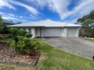 a house with a driveway in front of it at Upper Coomera Castle 2 in Gold Coast