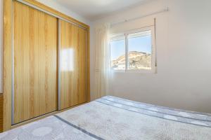 Postel nebo postele na pokoji v ubytování Urbanización Las Torres + 18 fotografií