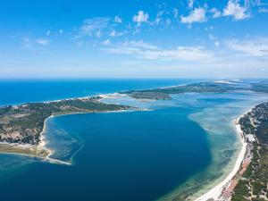 an aerial view of a beach and the ocean at San Martinho Beach Club in Vila Praia Do Bilene