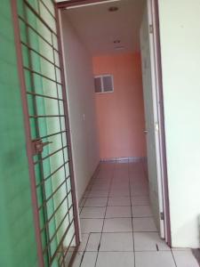 an empty hallway with an open door to a room at Hermosa Casa Vacacional MARINA in Playa del Carmen