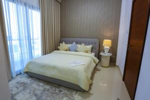 Postel nebo postele na pokoji v ubytování The Wave Villa - Al Dana Island Fujairah
