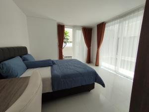 Ένα ή περισσότερα κρεβάτια σε δωμάτιο στο Rumah Menik