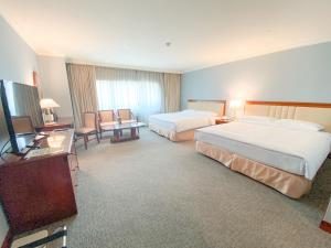 Gulta vai gultas numurā naktsmītnē Evergreen Laurel Hotel - Keelung