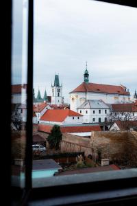 a view of a city from a window at Hotel Apollon in Litoměřice