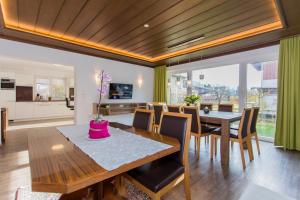 a dining room with a table and chairs at Holiday Home Hettlerhof in Maishofen