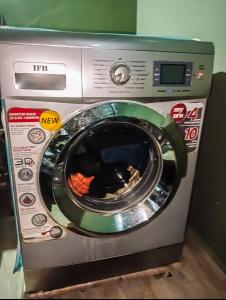 a washing machine is sitting in a room at NAKSHATHRA Guest House 2BHK in Tiruvannāmalai