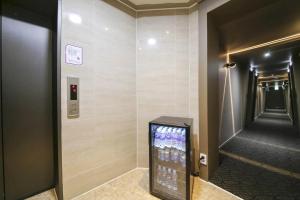 a hallway with a television in a elevator at Even Hotel in Gunsan