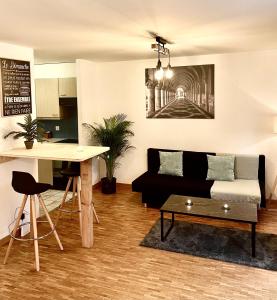 a living room with a couch and a table at appartement Montreux centre lac in Montreux