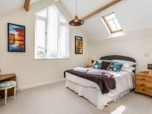 a bedroom with a bed and a window at 4 Bed in Brixham BX072 in Brixham