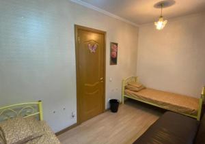 Кровать или кровати в номере Assem Hostel Dostyk