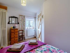 En eller flere senger på et rom på 3 Bed in Wroxham 78708