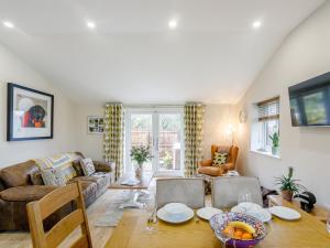 a living room with a couch and a table at 2 Bed in Stanton-by-Bridge 78581 