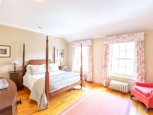 a bedroom with a bed and two windows at 5 Bed in Kilfinan CA007 in Kilfinan