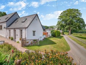 an aerial view of a white house with a yard at 1 Bed in Brecon BN015 in Brecon