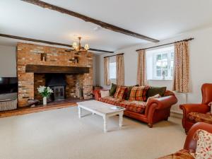 a living room with a couch and a fireplace at 3 Bed in Old Hunstanton 78821 in Hunstanton
