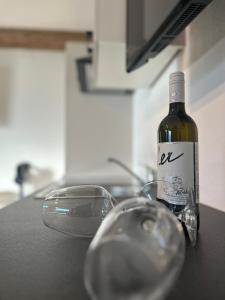 a bottle of wine sitting on top of a counter at Dolomitenblick Suite in Stronach