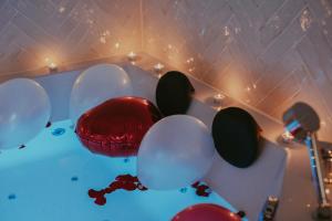 a room with red and white balloons in a room at Luxury Jacuzzi Apartment in Mostar