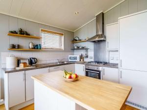 a kitchen with a bowl of fruit on a counter at 2 Bed in Caldbeck 80562 in Caldbeck
