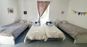 Postel nebo postele na pokoji v ubytování Maison 2 chambres Olsavinia
