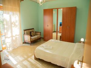 Postel nebo postele na pokoji v ubytování dimora del sole e del vento