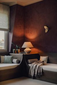 Postel nebo postele na pokoji v ubytování Design Hotel zum Hirschen Salzburg