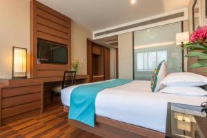 Postel nebo postele na pokoji v ubytování SSAW Boutique Hotel Hefei Intime Centre
