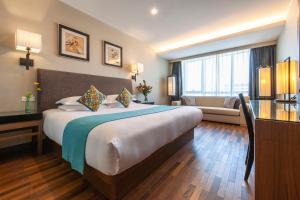 Postel nebo postele na pokoji v ubytování SSAW Boutique Hotel Hefei Intime Centre