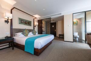 Postel nebo postele na pokoji v ubytování SSAW Boutique Hotel Hefei Intime Centre