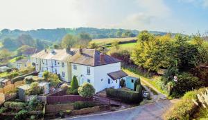 an aerial view of a white house in a village at Charnwood Cottage in Brading