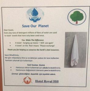 a sign that says save our planet and a tree at Hotel Royal Hill in Antalya